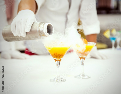 cocktail with liquid nitrogen, yellow Martini