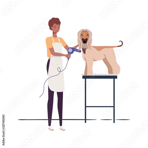 young woman with dog in pet groomer