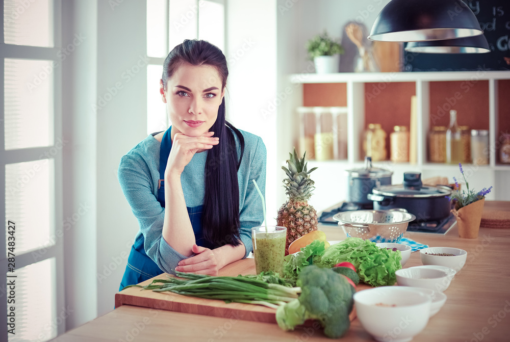 Young with with basket of fresh vegetables in the kitchen Young with with basket of fresh vegetables in the kitchen