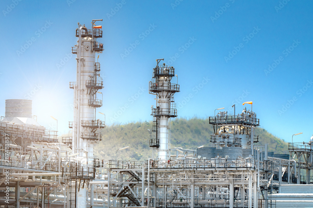 Close up Industrial view at oil refinery plant form industry zone with sunrise and cloudy sky Close up Industrial view at oil refinery plant form industry zone with sunrise and cloudy sky