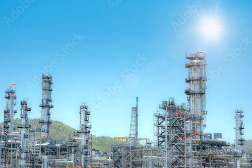 Oil and gas industrial,Oil refinery plant form industry,Refinery factory oil storage tank and pipeline steel with sunset and cloudy sky background,Thailand