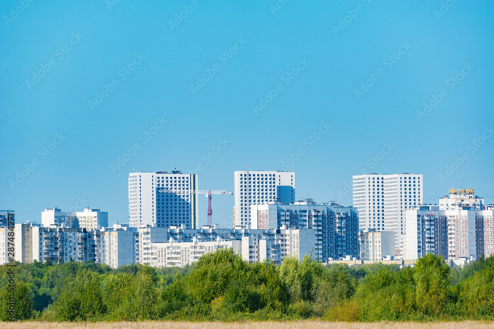 View of the new city district by the small forest and meadow. View of the new city district by the small forest and meadow.