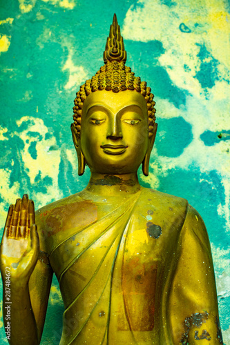 Standing Buddha statue in Analyo Thipayaram temple photo