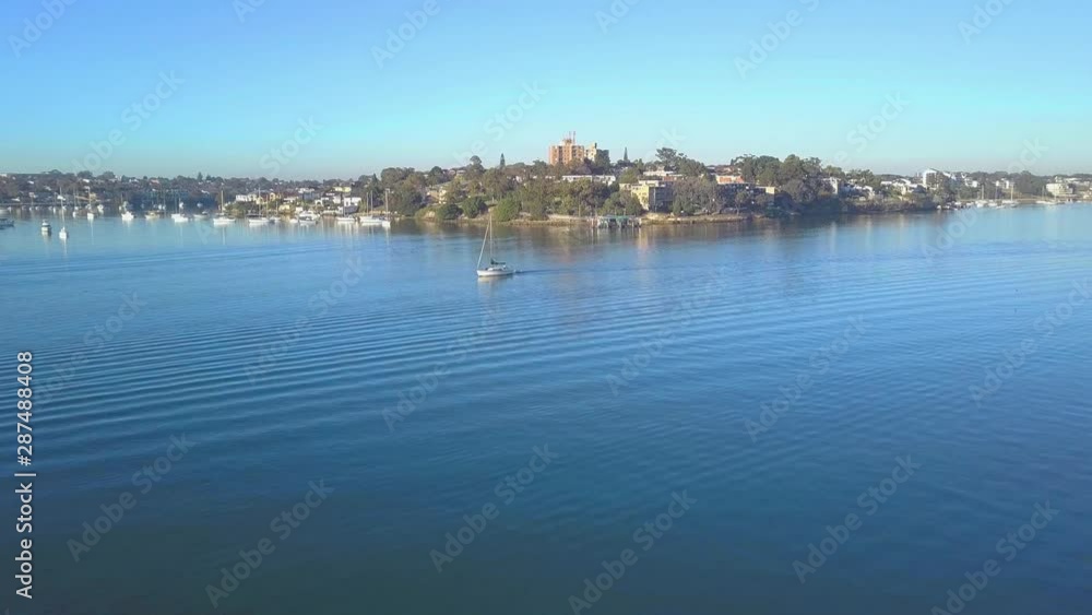 A Sailing Boat driving towards the City of Sydney - Australia A Sailing Boat driving towards the City of Sydney - Australia