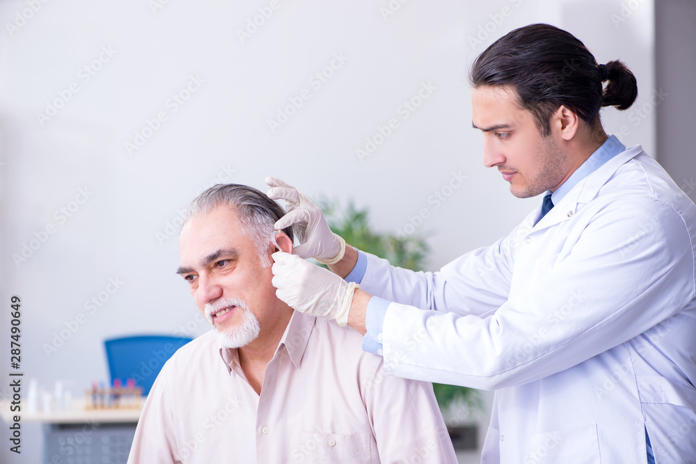 Male patient with hearing problem visiting doctor otorhinolaryng Male patient with hearing problem visiting doctor otorhinolaryng