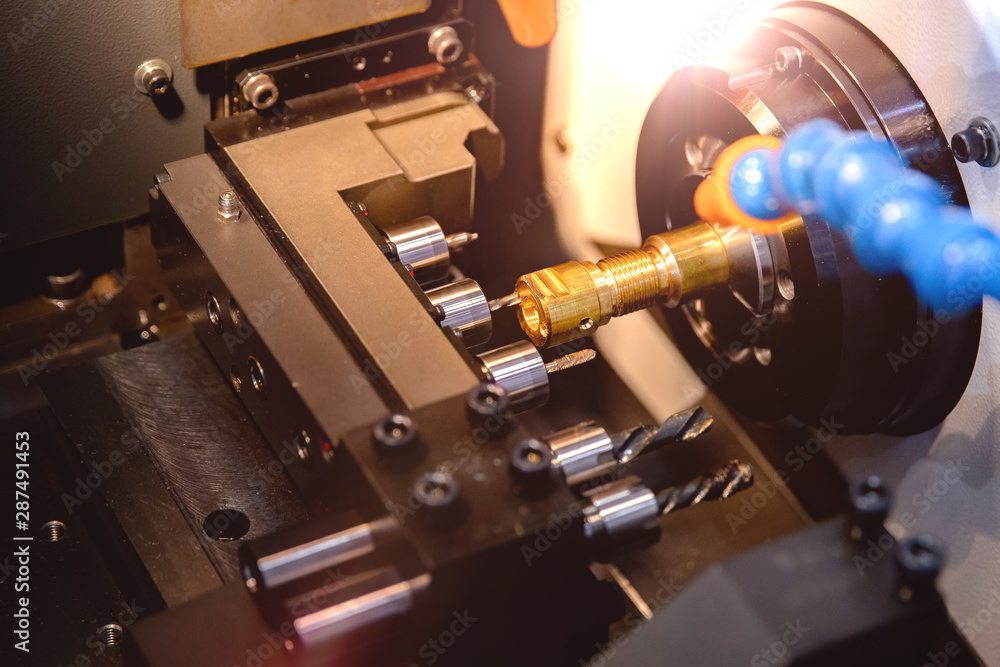 Fototapeta premium Close up CNC milling/drilling machine working process on metal factory,Industrial metal work process at steel structure industry.