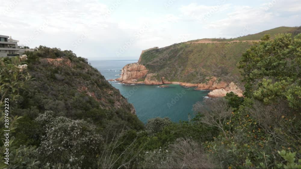 A beautiful summers day overlooking the Knysna Heads from a viewpoint with boats coming in and out of the Indian Ocean A beautiful summers day overlooking the Knysna Heads from a viewpoint with boats coming in and out of the Indian Ocean