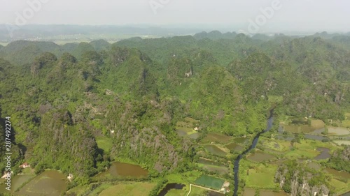 Limestone landscape in Tam Coc attract lot of tourist from all over the world. This sanctuary is a nice spot for start stroll in the nearby countryside into the wild nature photo