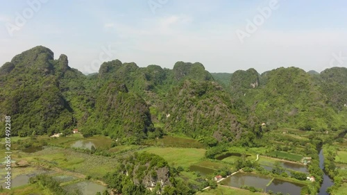 Limestone landscape in Tam Coc attract lot of tourist from all over the world. This sanctuary is a nice spot for start stroll in the nearby countryside into the wild nature photo