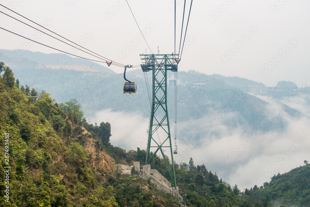 Cable car carrying passengers to Fansipan (3,143 m) mountain the highest mountains peak in Vietnam. This is the world's longest electric cable car. 