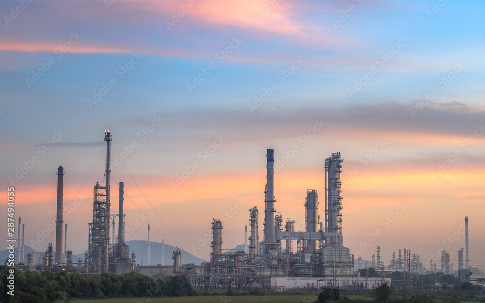 Oil and gas refinery plant form industry petroleum zone,Refinery equipment pipeline steel and oil storage tank at sunrise. -image Oil and gas refinery plant form industry petroleum zone,Refinery equipment pipeline steel and oil storage tank at sunrise. -image