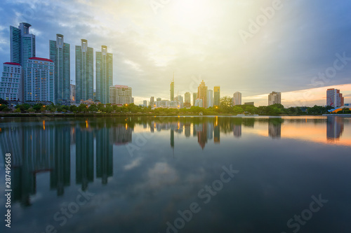 City building with water reflection before sunset