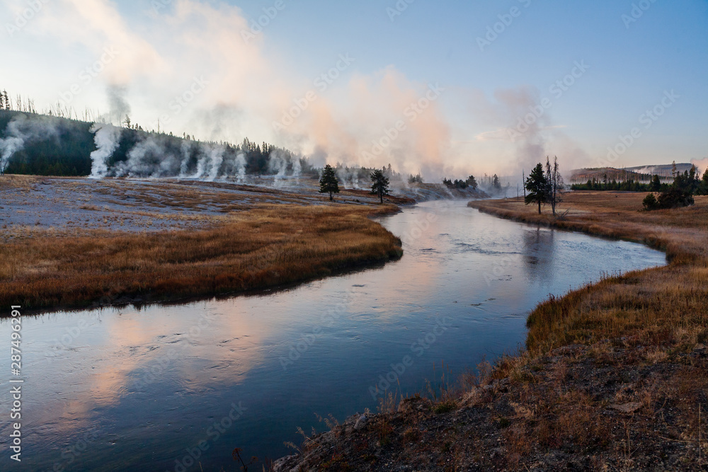 Geysers along the banks of the Firehole River at sunrise, Yellowstone National Park, WY