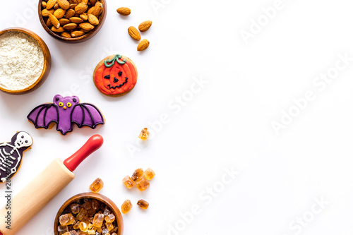 Cook halloween gingerbread cookies on white background top view copyspace