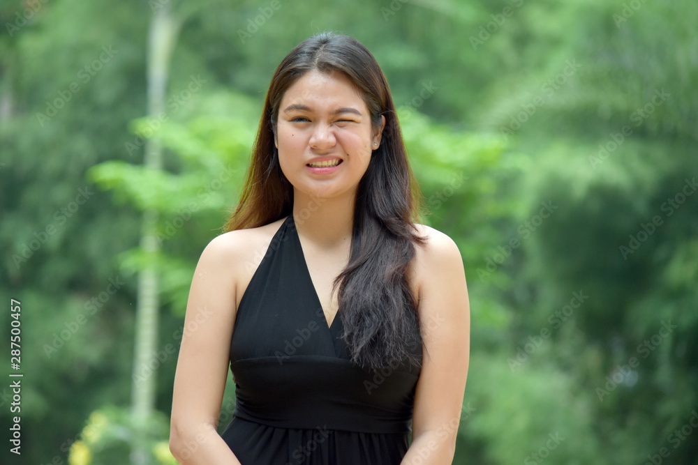 A Filipina Female Winking A Filipina Female Winking
