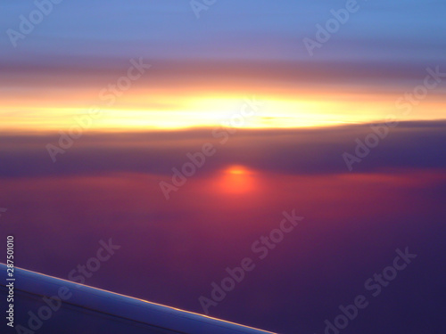 Airplane Wing and Surreal Sunset