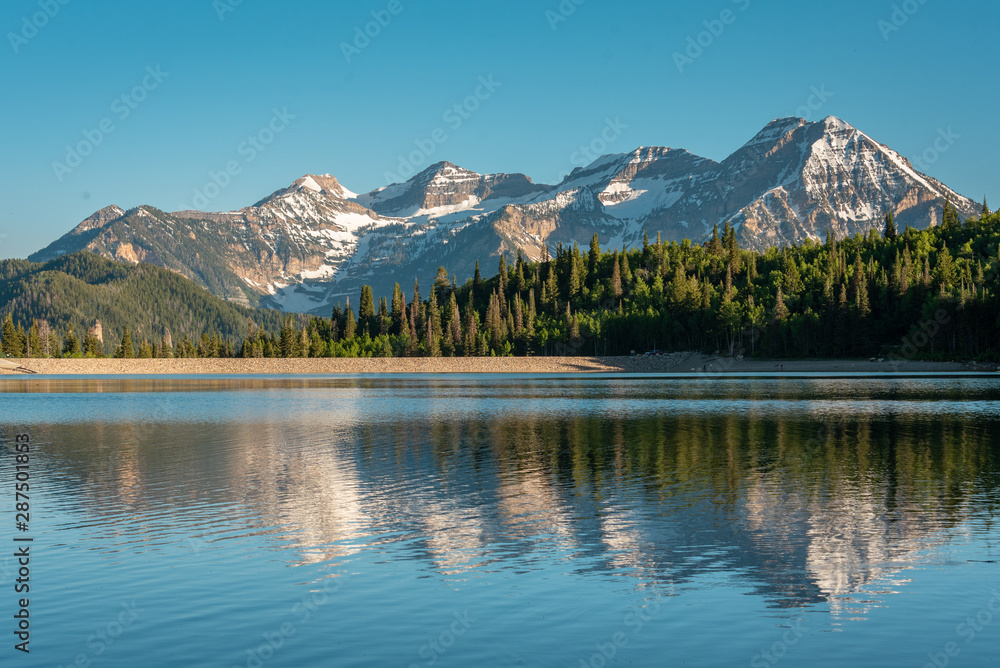 Mountains reflecting in Silver Lake Flat Reservoir, on the Alpine Loop Scenic Byway, in Uinta-Wasatch-Cache National Forest, Utah