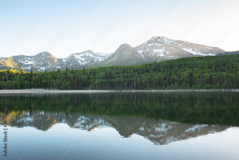 Mountains reflecting in Silver Lake Flat Reservoir, on the Alpine Loop Scenic Byway, in Uinta-Wasatch-Cache National Forest, Utah