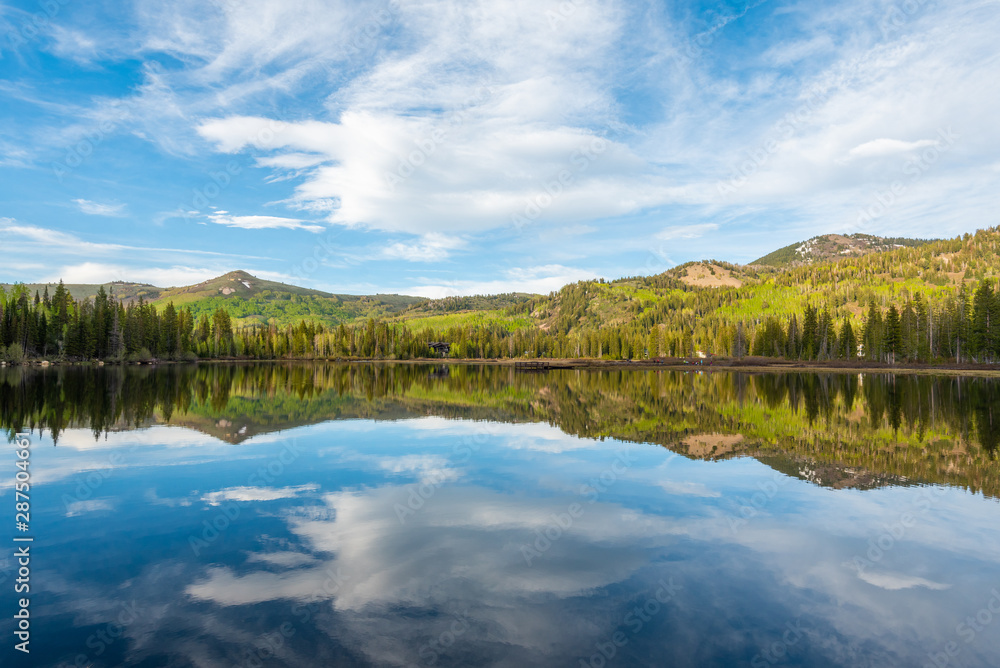 Reflections of mountains at Silver Lake, in Uinta-Wasatch-Cache National Forest, in Brighton, near Park City, Utah
