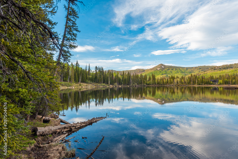 Reflections of mountains at Silver Lake, in Uinta-Wasatch-Cache National Forest, in Brighton, near Park City, Utah