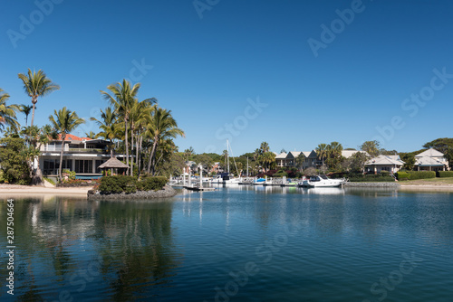 A waterside residential area in Coolangatta with personal moorings for boats. Gold Coast, Queensland, Australia.