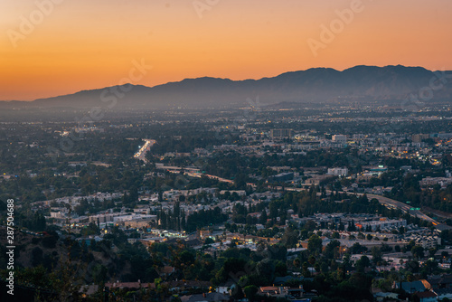 View of the San Fernando Valley at sunset, from Mulholland Drive, in Los Angeles, California © jonbilous