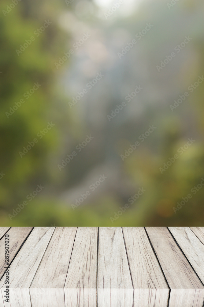 Fototapeta premium green bokeh and wood floor. nature. photo