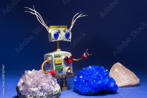 Tableau sur toile Crazy robot toy with minerals on dark background.