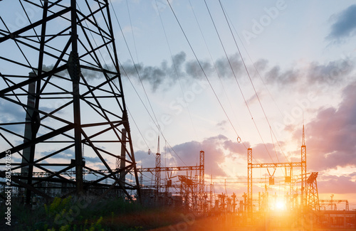 High-voltage power lines. Electricity distribution station. high voltage electric transmission tower. Distribution electric substation with power lines and transformers