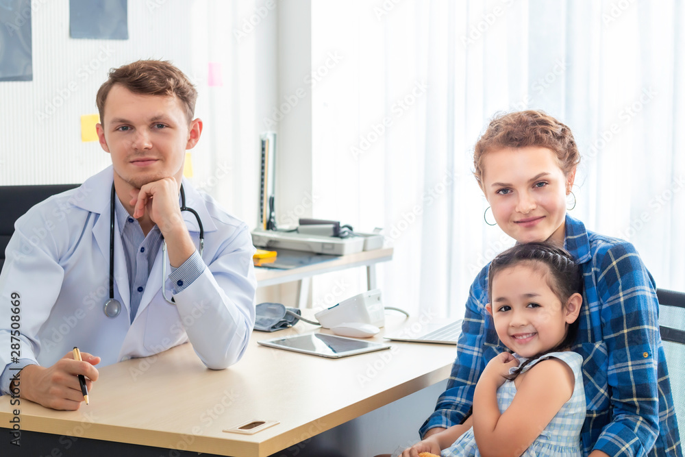 Pediatrician (doctor) man , mother and little daughter smiling in hospital. Pediatrician (doctor) man , mother and little daughter smiling in hospital.