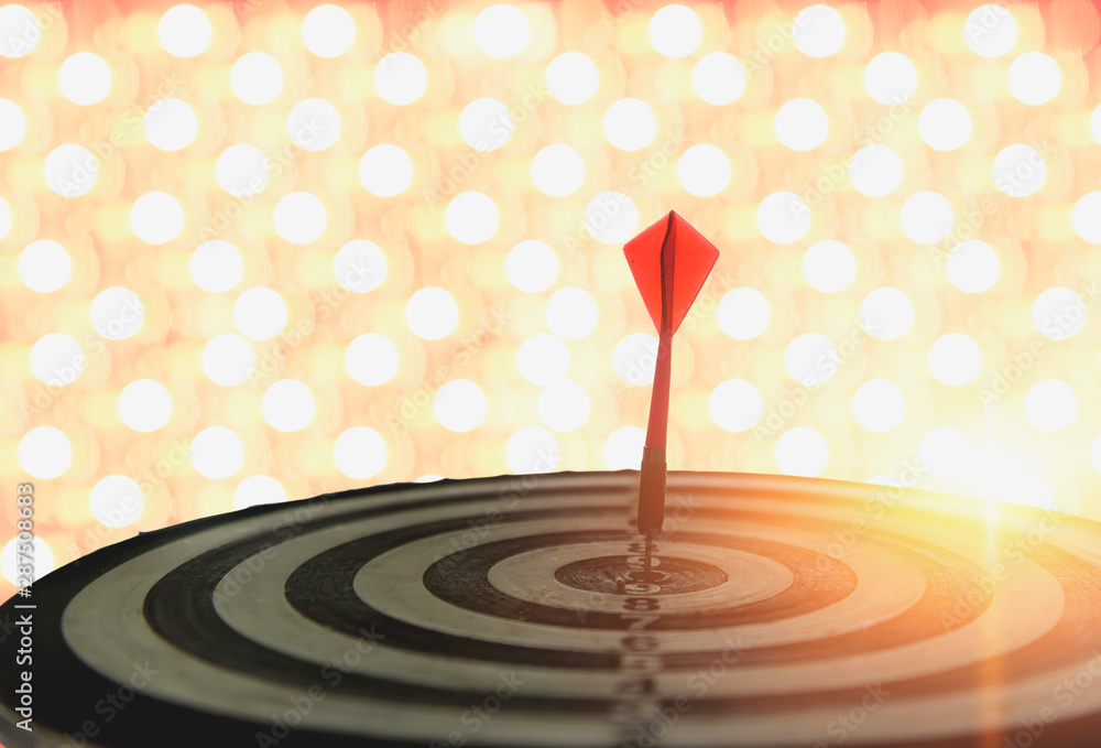 Dart with arrows on the bokeh blur background comparing to the number one target marketing concept and success. Dart with arrows on the bokeh blur background comparing to the number one target marketing concept and success.