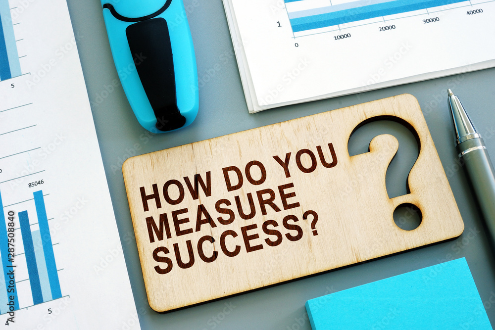 How Do You Measure Business Success How do you measure success written sign and business report with kpi