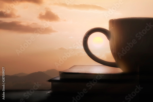 silhouette of coffee cup with sunset.