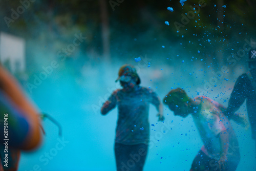 Ho Chi Minh City/ Vietnam - September 2017: Royalty high quality free stock photo of unidentified people are attending jogging festival with color powder. Color run event.
