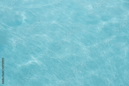 Surface of swimming pool water background.