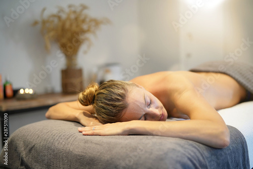 Woman relaxing on massage bed