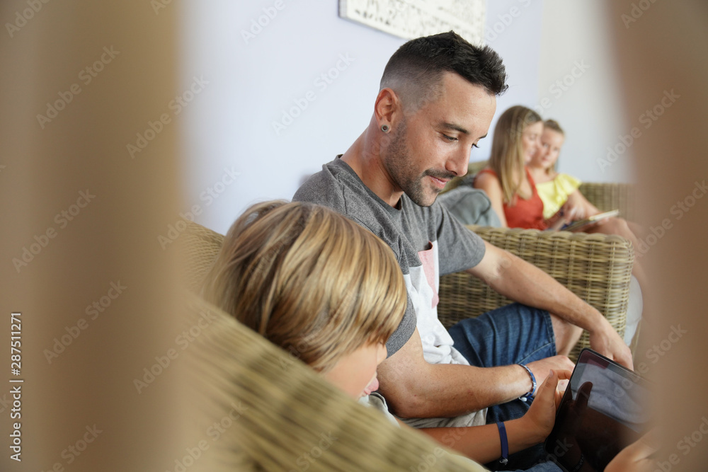 Fototapeta premium Closeup of family using digital tablet