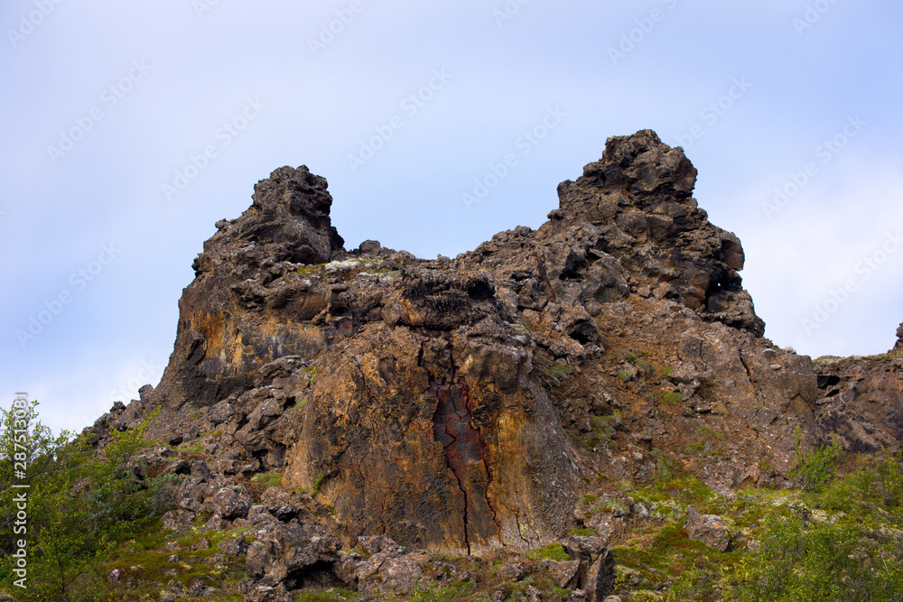 Dimmuborgir or the Black Fortress is a dramatic expanse of lava in the Lake Mývatn area. Iceland, Europe. Dimmuborgir or the Black Fortress is a dramatic expanse of lava in the Lake Mývatn area. Iceland, Europe.