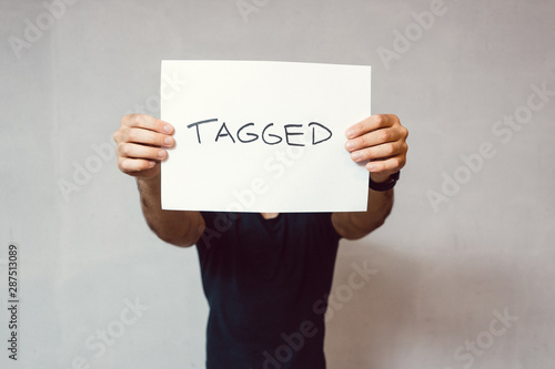 Man holding paper sign