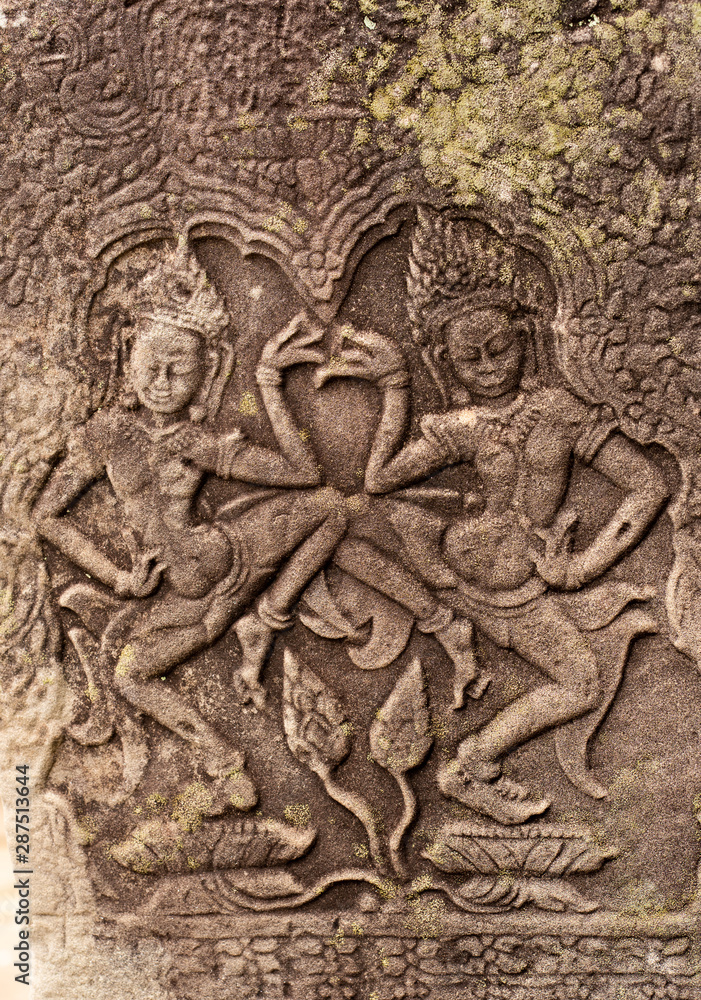 Khmer classical nymphs, Apsara dancer carvings on the wall at Angkor wat, Siem Reap, Cambodia.