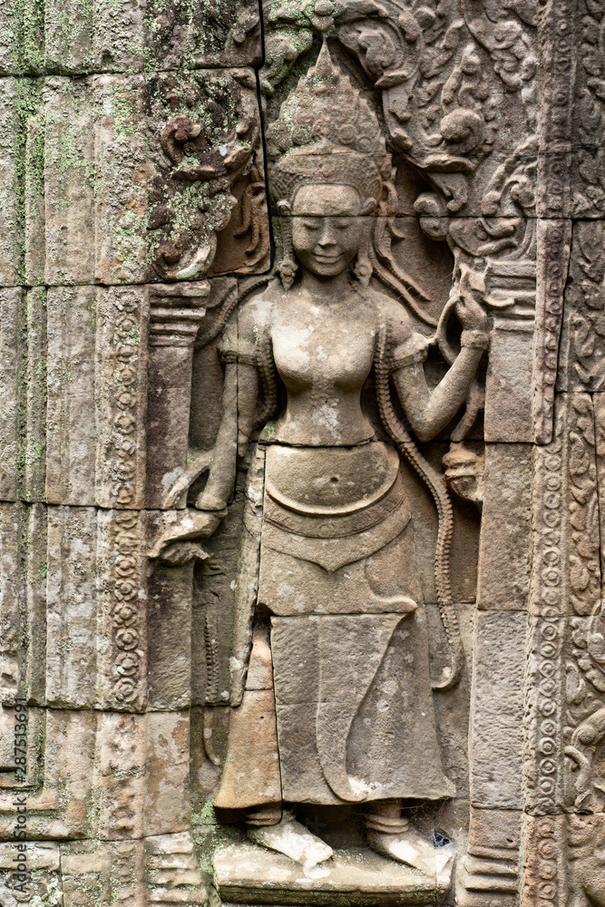 Khmer classical nymphs, Apsara dancer carvings on the wall at Angkor wat, Siem Reap, Cambodia.