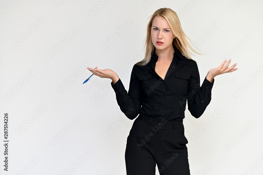 Portrait of a pretty blonde girl in a black suit on a white background. Beauty, brightness, happiness, business look. Shows different emotions in different poses.