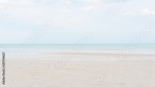 Beautiful beach clear sea and sand with free space. ( Panorama Ratio )