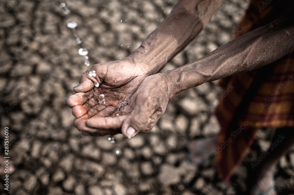 Elderly men are exposed to rainwater in dry weather,global warming,selective focus