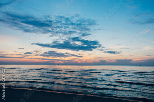 Colorful ocean beach sunrise.