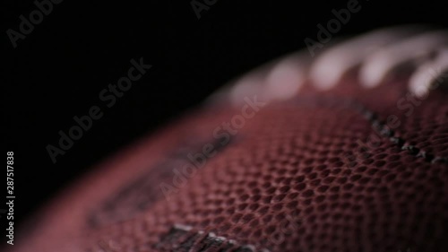 Darkened close up of American Football laces F