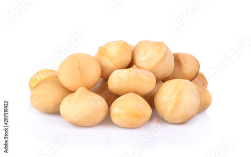 Salted macadamia nuts isolated on white background.