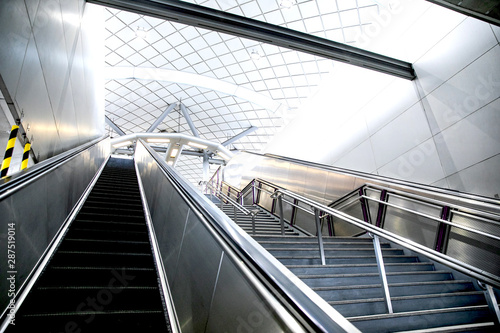 Stairs from underground upward in modern city space.