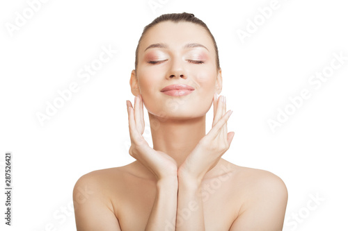 woman with clean skin touches her cheek with her hand. Perfect face skin concept on a white background.