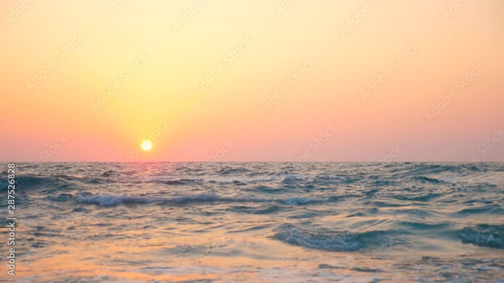 Sea and waves on a sunset background, slow motion. Sea and waves on a sunset background, slow motion.
